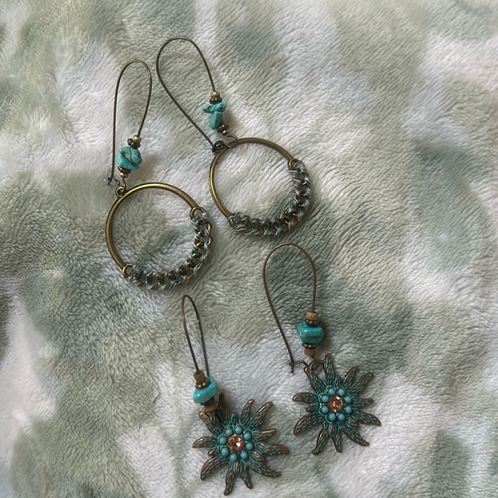Earring bundle. A set of two bronze colored dangle earrings with teal coloring